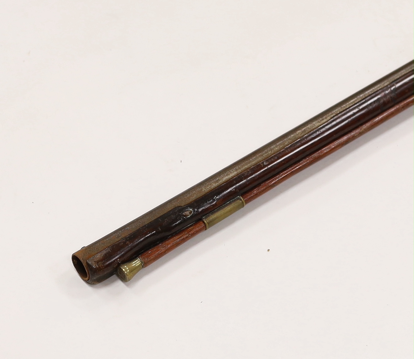 A 1786 percussion 12 bore fowling piece, converted from flintlock, with a fully stocked half octagonal barrel, London proofs, brass furniture and sideplate engraved IR 1786, chequered grip and wooden ramrod, barrel 96cm